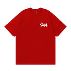 The T-shirt is an EVISU short-sleeve tee featuring a skull and large "M" print.