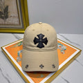 A cream-colored baseball cap by Chrome Hearts.