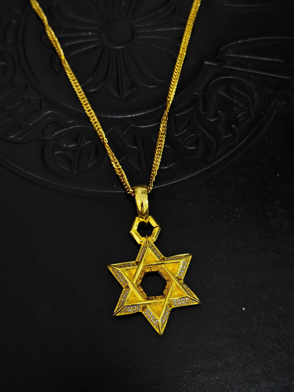 A full-diamond six-pointed star pendant necklace from Chrome Hearts.
