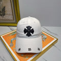 A white washed and distressed baseball cap from Chrome Hearts.