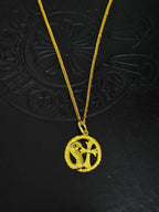 A snake-shaped cross necklace from Chrome Hearts.