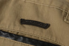 Chrome Hearts khaki straight-leg pants with colorful leather cross patch
