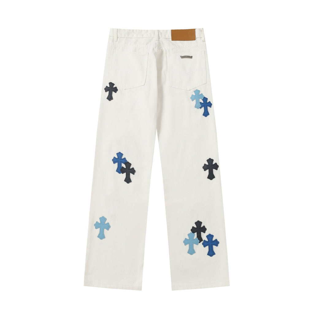 Chrome Hearts' classic white denim jeans with a colored leather cross wash.