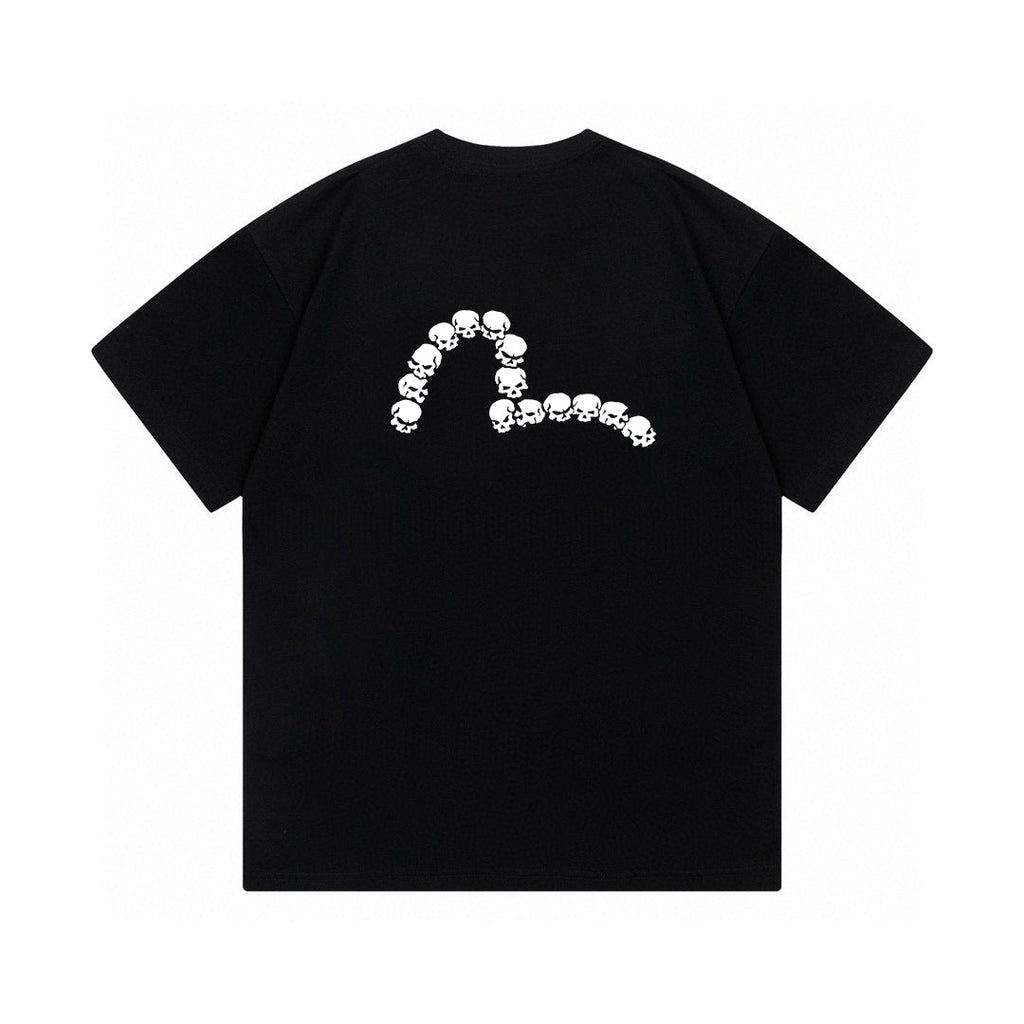 The T-shirt is an EVISU short-sleeve tee featuring a skull and large "M" print.