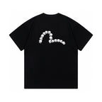 The T-shirt is an EVISU short-sleeve tee featuring a skull and large "M" print.