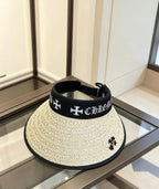 A black woven visor sun hat from Chrome Hearts.