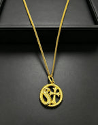 A snake-shaped cross necklace from Chrome Hearts.