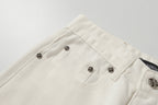 Chrome Hearts' classic white denim jeans with a colored leather cross wash.