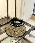 A black woven visor sun hat from Chrome Hearts.