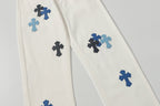 Chrome Hearts' classic white denim jeans with a colored leather cross wash.