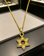 A full-diamond six-pointed star pendant necklace from Chrome Hearts.