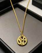 A snake-shaped cross necklace from Chrome Hearts.
