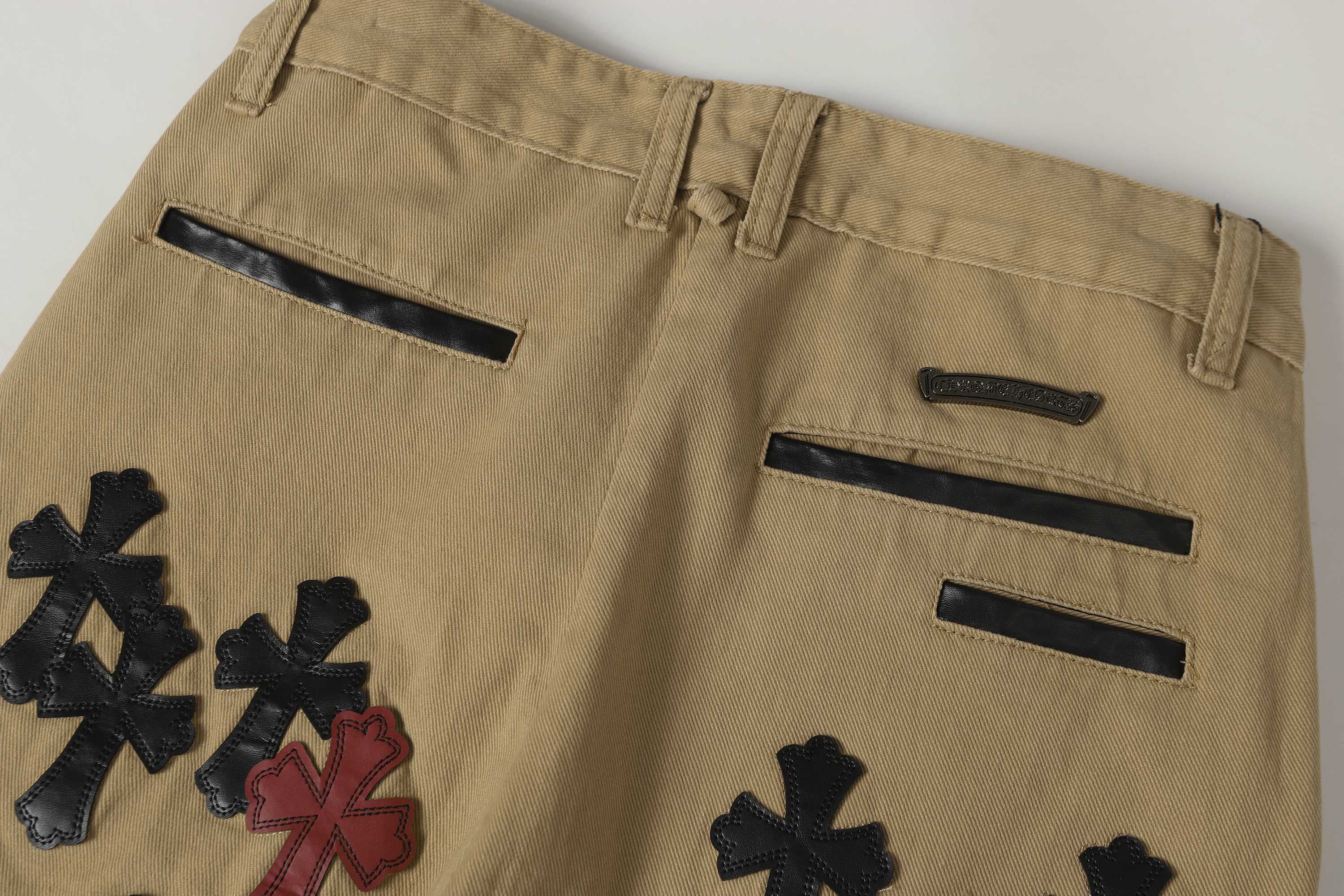 Chrome Hearts khaki straight-leg pants with colorful leather cross patch