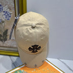 A cream-colored baseball cap by Chrome Hearts.