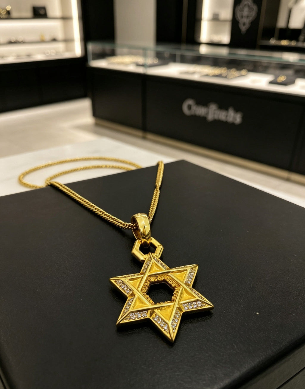 A full-diamond six-pointed star pendant necklace from Chrome Hearts.