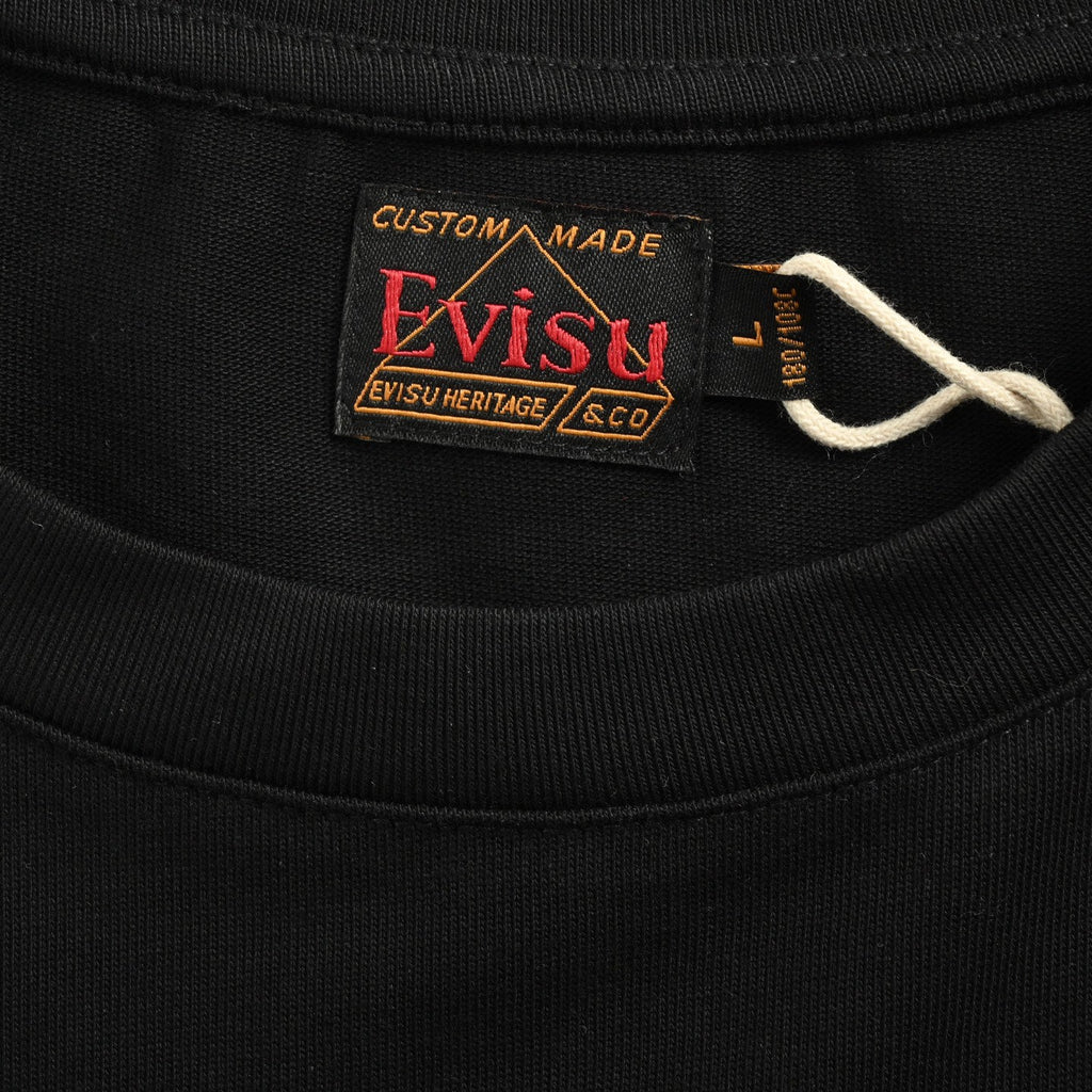 The T-shirt is from EVISU's "Heart-Hand Buddha Head" series.
