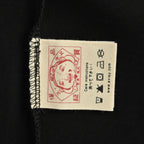 The T-shirt is from EVISU's "Heart-Hand Buddha Head" series.