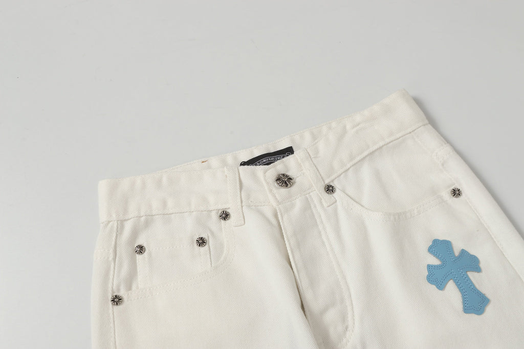 Chrome Hearts' classic white denim jeans with a colored leather cross wash.