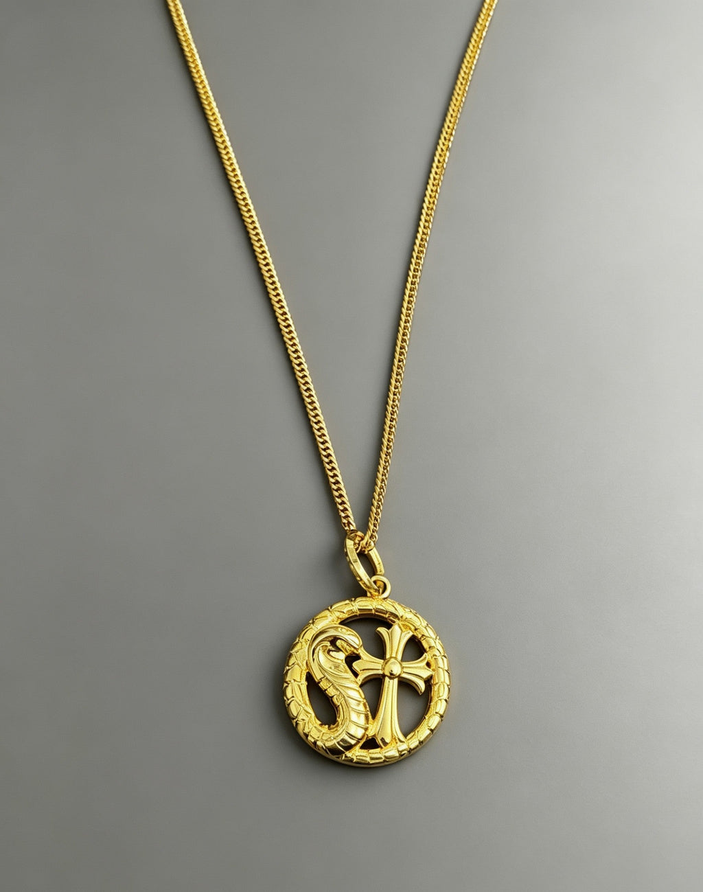 A snake-shaped cross necklace from Chrome Hearts.