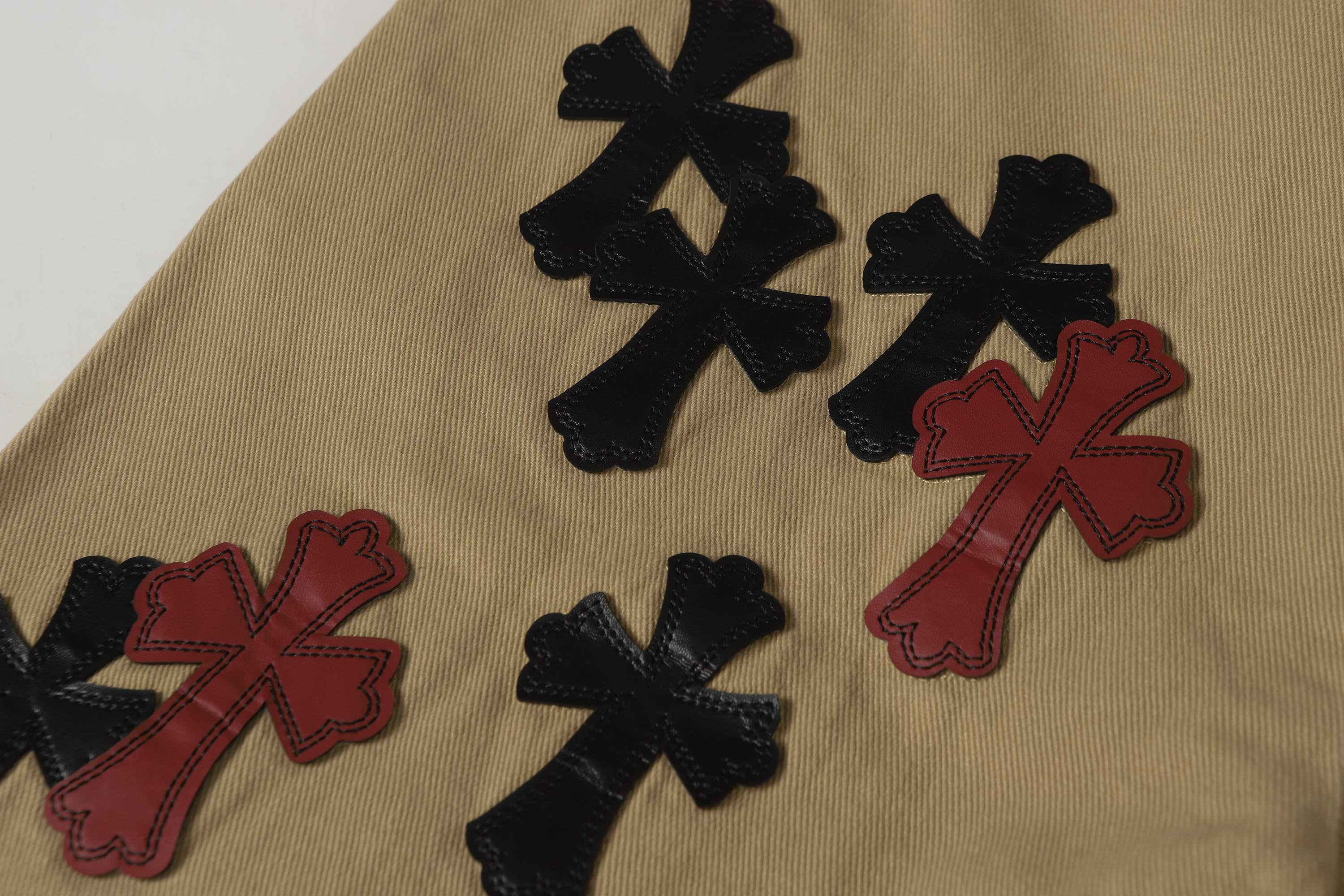 Chrome Hearts khaki straight-leg pants with colorful leather cross patch