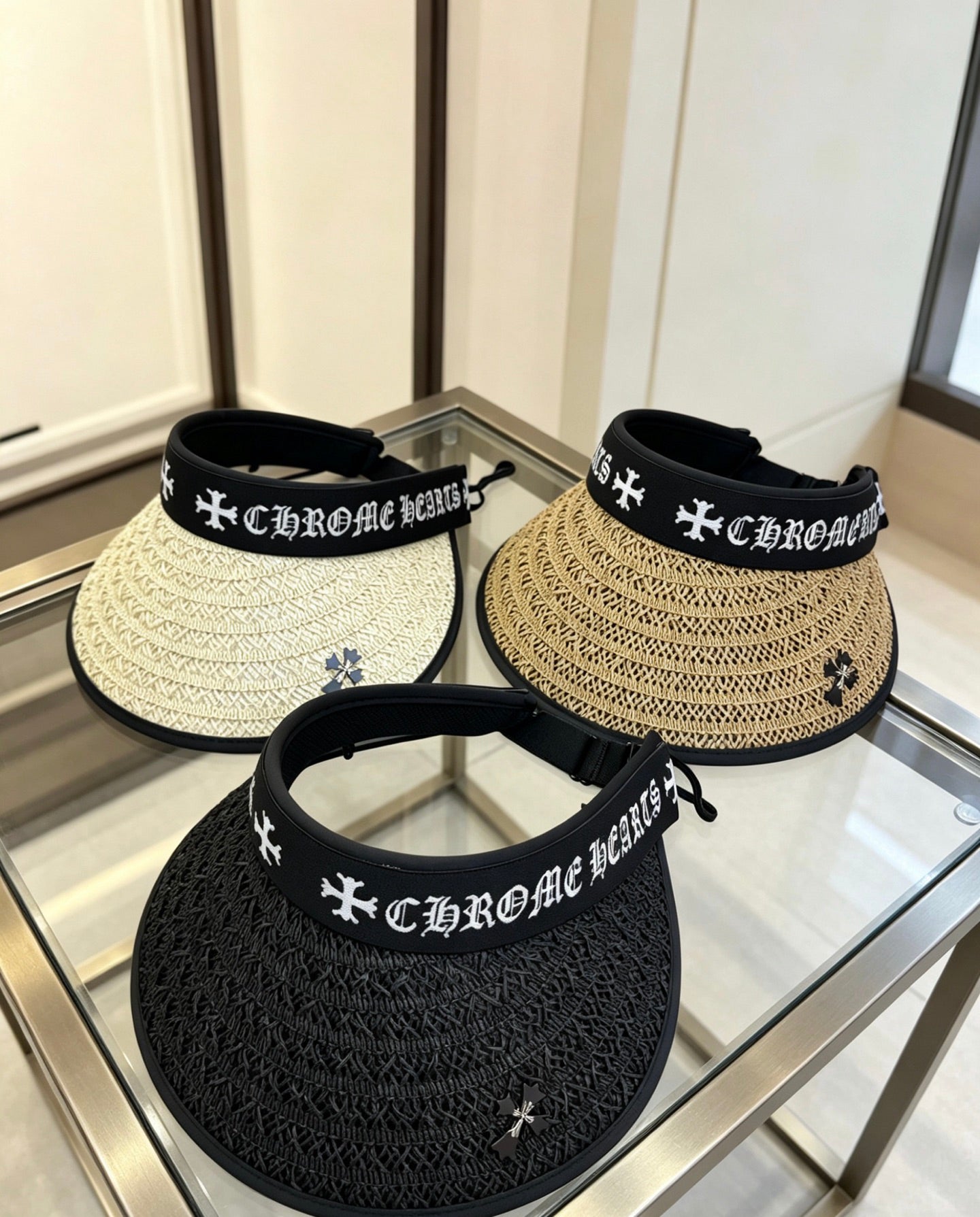 A black woven visor sun hat from Chrome Hearts.