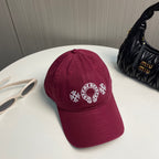 A burgundy baseball cap from Chrome Hearts.