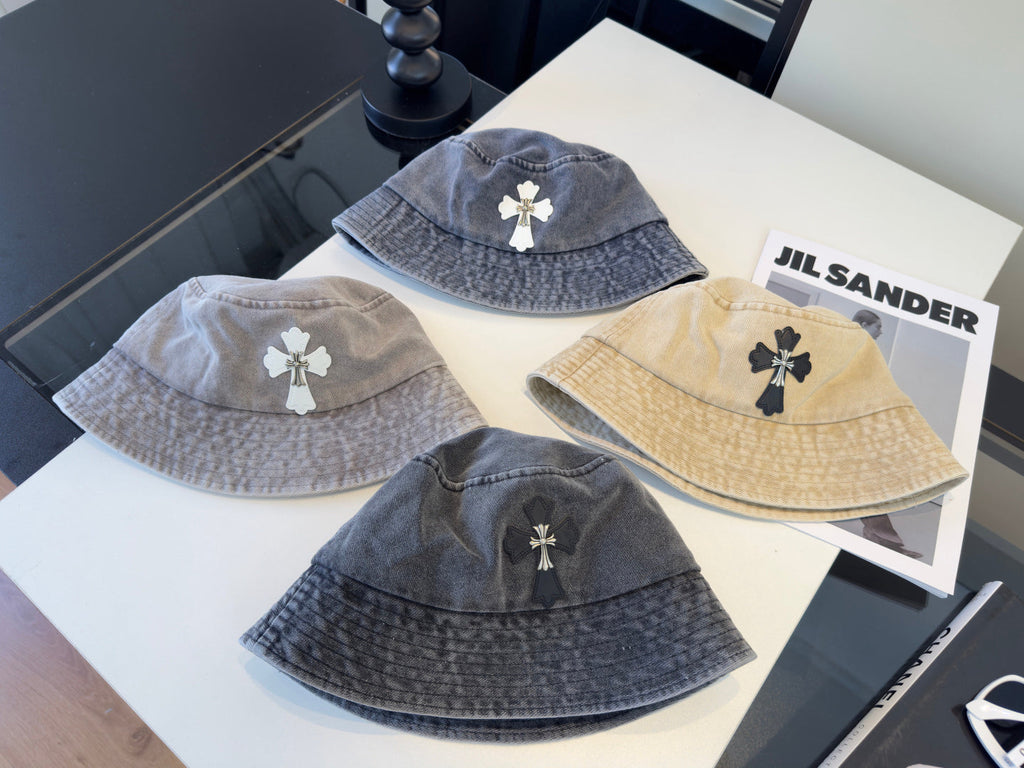 A grey washed denim bucket hat from Chrome Hearts.