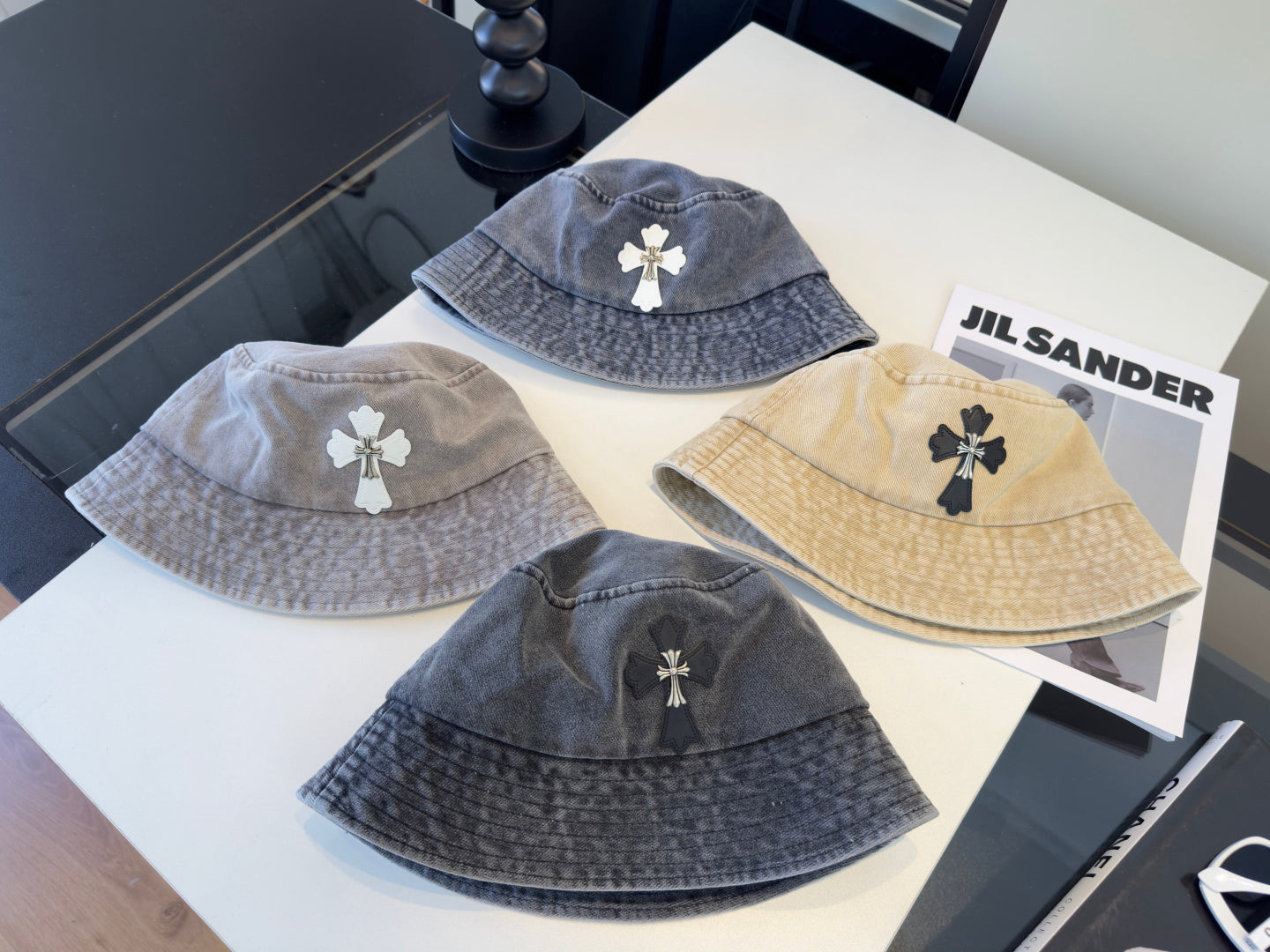 A grey washed denim bucket hat from Chrome Hearts.