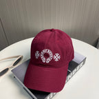 A burgundy baseball cap from Chrome Hearts.