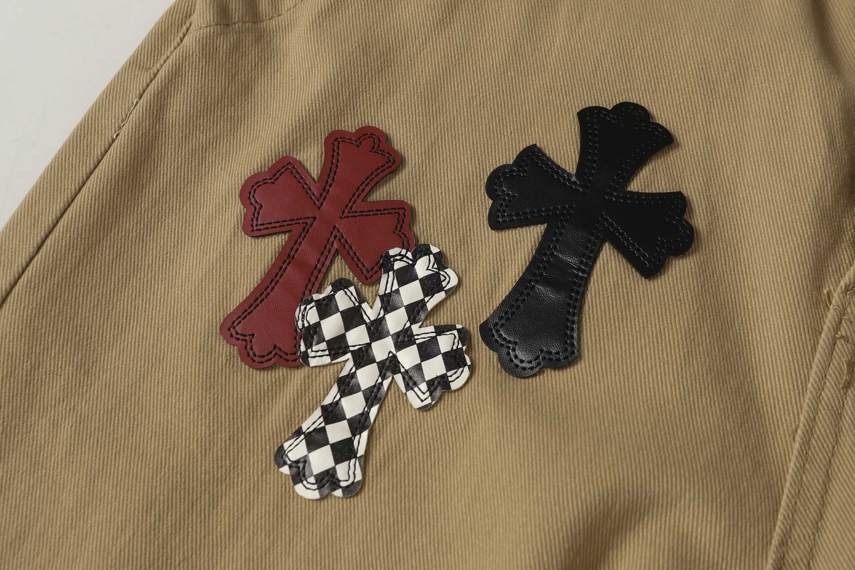 Chrome Hearts khaki straight-leg pants with colorful leather cross patch