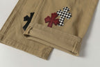 Chrome Hearts khaki straight-leg pants with colorful leather cross patch